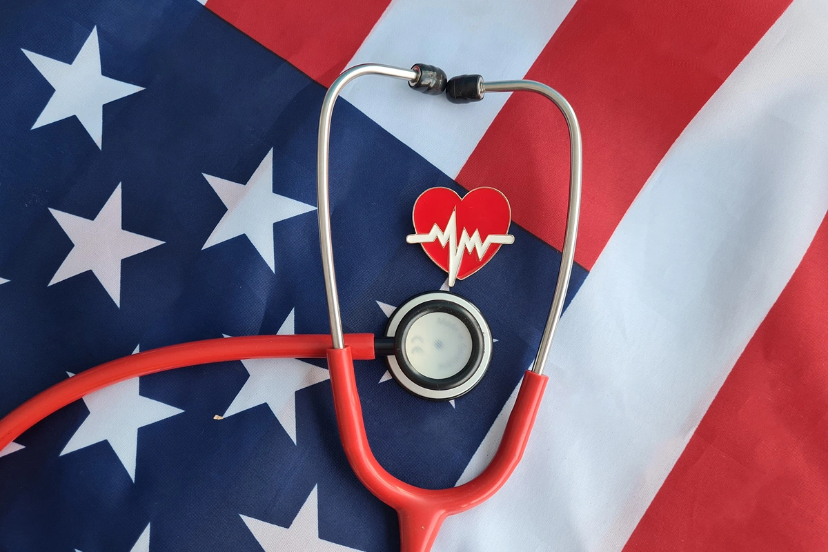 Medical theme with flag and stethoscope