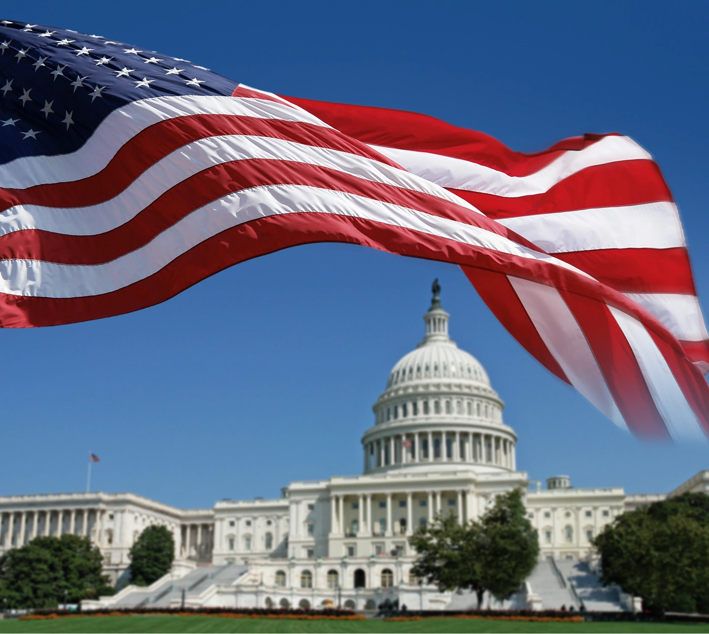 Capitol Building under American flag sky
