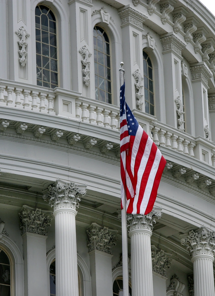 American flag in front of Capitol building